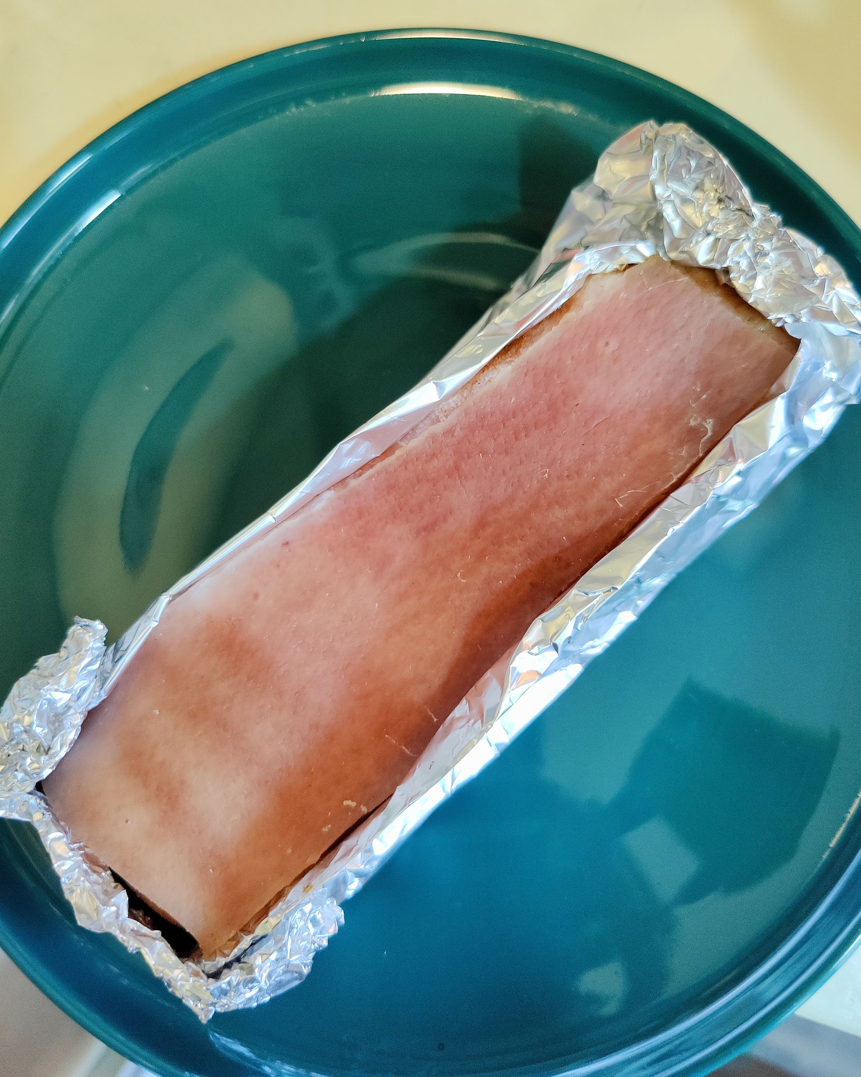 Pork belly wrapped with aluminum foil