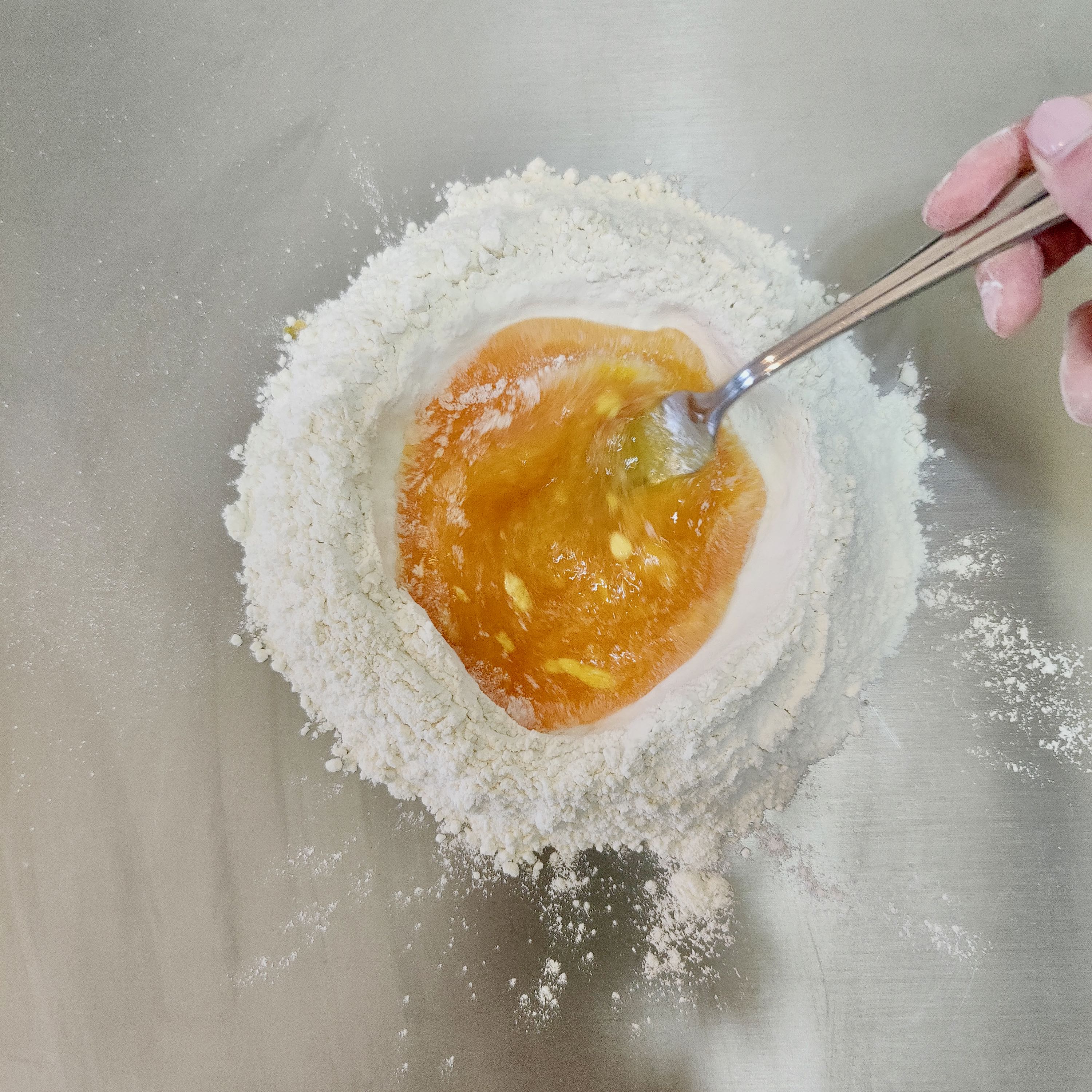 whisking the egg together with the flour 