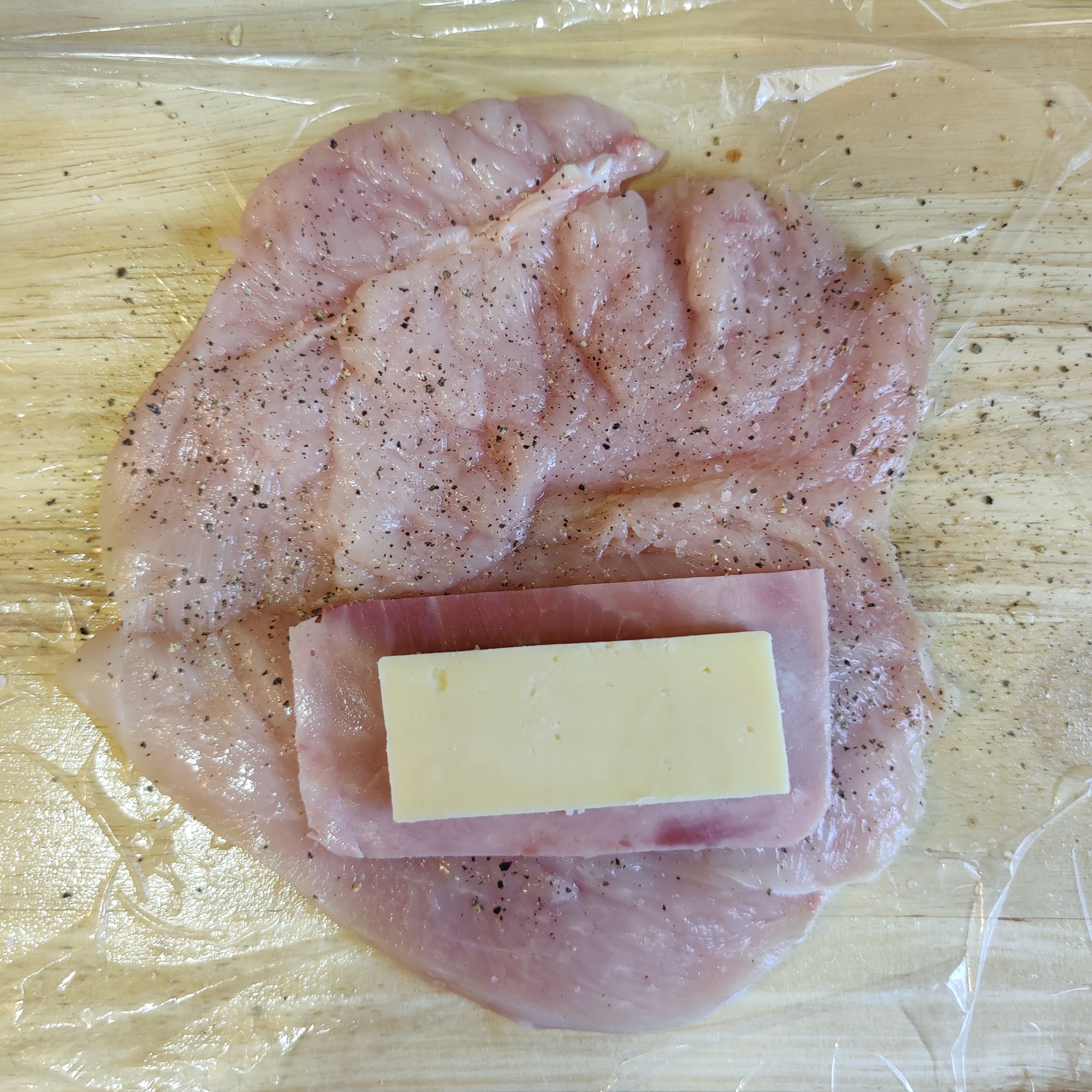 chicken breast with a slice of ham and cheese 