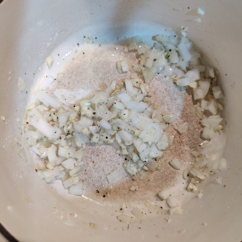 cook the onion and garlic in a pot 