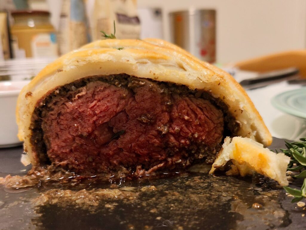 Cutting open the beef wellington 